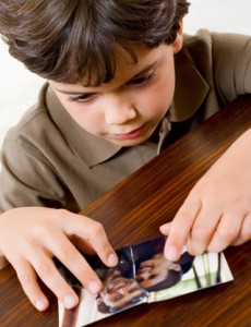 Boy with a Torn Family Photo